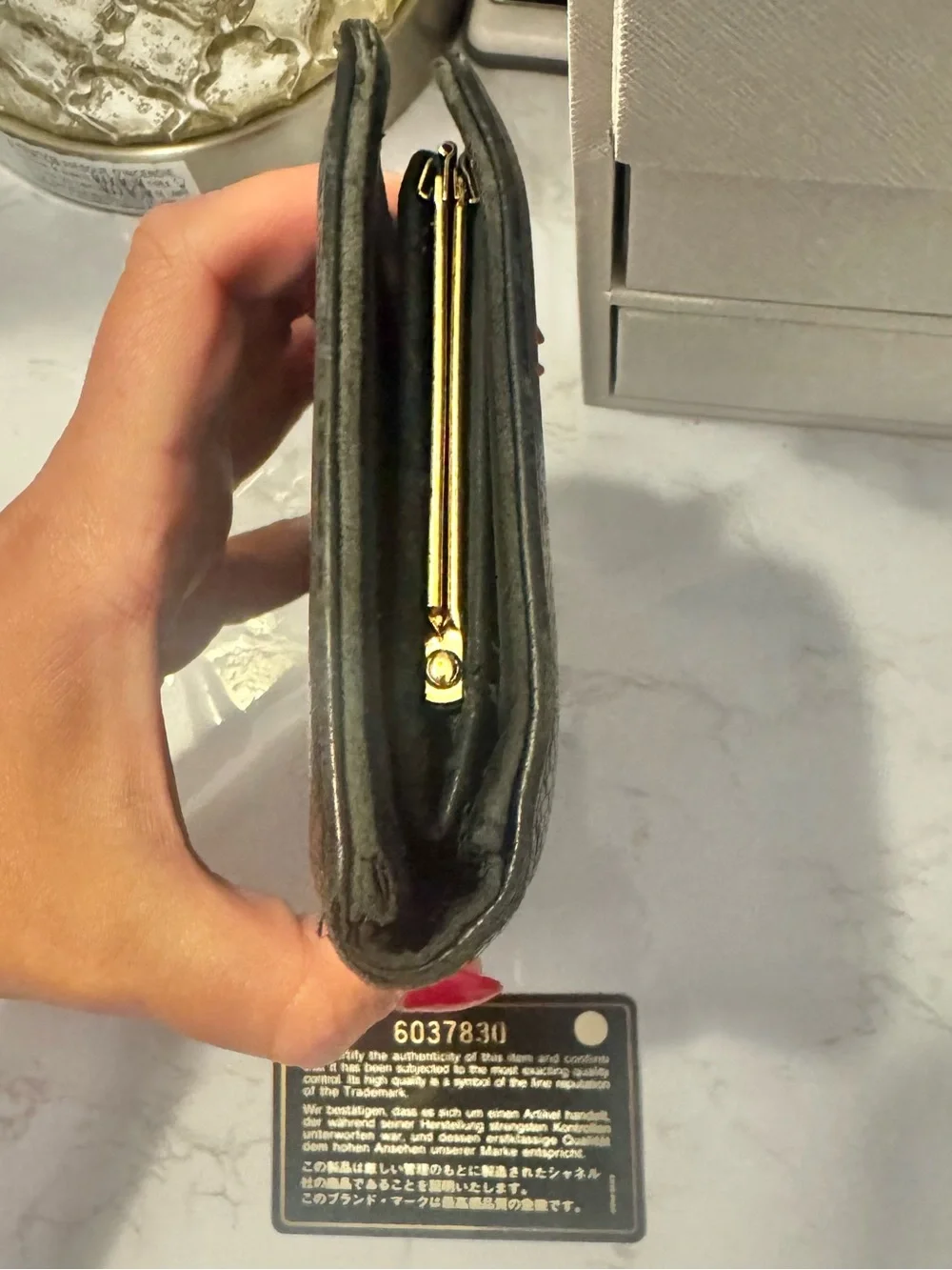 CHANEL Black Quilted CC Leather Wallet with Snap Closure